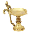 Brass peacock parrot Diya - exquisitely crafted brass oil lamp in the shape of a peacock with parrot motifs, golden finish, decorative home accent, fusion of elegance and vibrancy, traditional Indian Diya, emits a captivating and auspicious glow, perfect for festive occasions and religious ceremonies, enhances spiritual ambiance and decor with a touch of artistic brilliance.