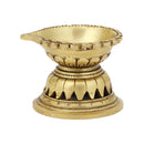 Brass Diya - exquisitely crafted brass oil lamp, traditional design, golden finish, decorative home accent, symbolizes spirituality and enlightenment, emits a warm and tranquil glow, ideal for religious ceremonies and festive occasions, enhances ambiance and decor with a touch of traditional elegance.