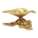 Brass Leaf Diya - elegantly crafted brass oil lamp in the shape of a leaf, golden finish, decorative home accent, inspired by nature's beauty, traditional Indian Diya, emits a soft and serene glow, ideal for religious ceremonies and festive occasions, enhances spiritual ambiance and decor with a touch of natural charm.