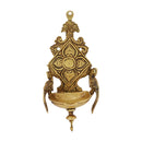 Brass Wall Diya - intricately designed brass oil lamp for wall mounting, golden finish, decorative home accent, traditional Indian Diya, emits a warm and inviting glow, ideal for enhancing wall decor and creating an ambiance of serenity, perfect for religious ceremonies and festive occasions, adds a touch of traditional charm to interior spaces.