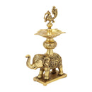 Brass peacock parrot Diya - exquisitely crafted brass oil lamp in the shape of a peacock with parrot motifs, golden finish, decorative home accent, fusion of elegance and vibrancy, traditional Indian Diya, emits a captivating and auspicious glow, perfect for festive occasions and religious ceremonies, enhances spiritual ambiance and decor with a touch of artistic brilliance.