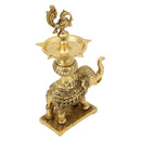 Brass peacock parrot Diya - exquisitely crafted brass oil lamp in the shape of a peacock with parrot motifs, golden finish, decorative home accent, fusion of elegance and vibrancy, traditional Indian Diya, emits a captivating and auspicious glow, perfect for festive occasions and religious ceremonies, enhances spiritual ambiance and decor with a touch of artistic brilliance.