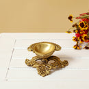 Brass small Akhand Diya - intricately designed brass oil lamp, compact size, traditional Indian Diya, golden finish, decorative home accent, emits a warm and serene glow, ideal for religious ceremonies and meditation, enhances spiritual ambiance and decor.