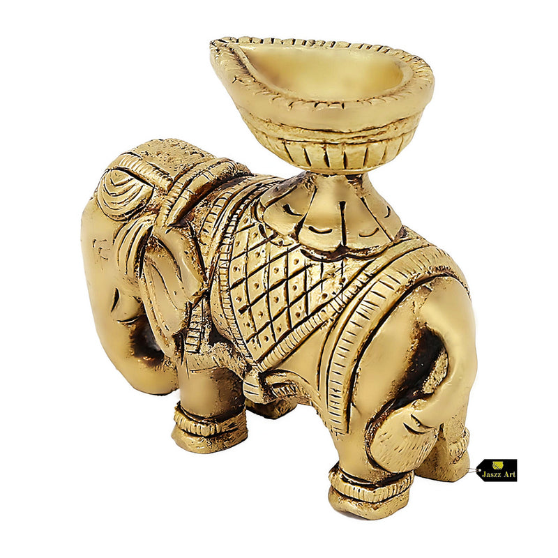  Brass Elephant Diya - intricately designed brass oil lamp in the shape of an elephant, golden finish, decorative home accent, symbolizes strength and wisdom, traditional Indian Diya, emits a warm and enchanting glow, ideal for religious ceremonies and festive occasions, enhances spiritual ambiance and decor