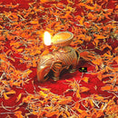 Brass Elephant Diya - intricately designed brass oil lamp in the shape of an elephant, golden finish, decorative home accent, symbolizes strength and wisdom, traditional Indian Diya, emits a warm and enchanting glow, ideal for religious ceremonies and festive occasions, enhances spiritual ambiance and decor