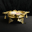 Brass 4 Diya Urli - beautifully crafted brass decorative bowl with four diya (oil lamp) holders, golden finish, traditional Indian Urli, versatile home accent, ideal for lighting multiple diya simultaneously, adds a touch of warmth and radiance to any space, perfect for creating a festive ambiance and enhancing interior decor, a charming centerpiece for religious ceremonies and celebratory occasions.