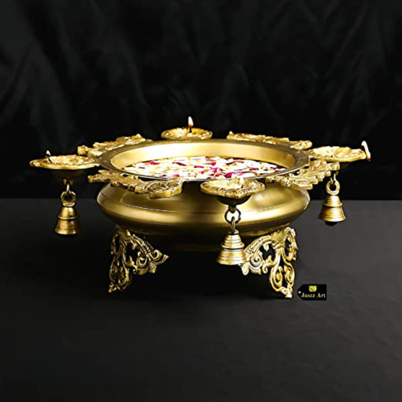 Brass 4 Diya Urli - beautifully crafted brass decorative bowl with four diya (oil lamp) holders, golden finish, traditional Indian Urli, versatile home accent, ideal for lighting multiple diya simultaneously, adds a touch of warmth and radiance to any space, perfect for creating a festive ambiance and enhancing interior decor, a charming centerpiece for religious ceremonies and celebratory occasions.