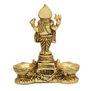 Brass Ganesha Diya - meticulously designed brass oil lamp in the shape of Lord Ganesha, golden finish, decorative home accent, symbolizes wisdom and auspiciousness, traditional Indian Diya, emits a divine and blissful glow, perfect for religious ceremonies and worship, enhances spiritual ambiance and decor with the divine presence of Lord Ganesha.