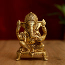 Brass God Ganesha Ji - intricately designed brass statue of Lord Ganesha, golden finish, auspicious and beloved deity, perfect for home decor and spiritual spaces, ideal for invoking blessings and removing obstacles, symbolizes wisdom, prosperity, and good fortune, enhances the spiritual energy and fosters a sense of divine presence, a sacred and revered addition to your collection of brass sculptures and figurines.