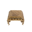 Brass Chowki - intricately carved brass platform, golden finish, perfect for placing deities or sacred objects during religious ceremonies and rituals, enhances the sanctity and beauty of the worship space, symbolizes stability and divine presence, adds a touch of elegance to your home puja setup, a valuable and ornamental addition to your collection of brass religious artifacts and decor.