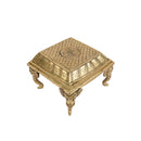 Brass Chowki - intricately carved brass platform, golden finish, perfect for placing deities or sacred objects during religious ceremonies and rituals, enhances the sanctity and beauty of the worship space, symbolizes stability and divine presence, adds a touch of elegance to your home puja setup, a valuable and ornamental addition to your collection of brass religious artifacts and decor.