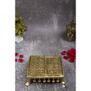 Brass Chowki - intricately carved brass platform, golden finish, perfect for placing deities or sacred objects during religious ceremonies and rituals, enhances the sanctity and beauty of the worship space, symbolizes stability and divine presence, adds a touch of elegance to your home puja setup, a valuable and ornamental addition to your collection of brass religious artifacts and decor.