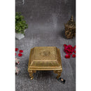 Brass Chowki - intricately carved brass platform, golden finish, perfect for placing deities or sacred objects during religious ceremonies and rituals, enhances the sanctity and beauty of the worship space, symbolizes stability and divine presence, adds a touch of elegance to your home puja setup, a valuable and ornamental addition to your collection of brass religious artifacts and decor.