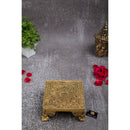 Brass Chowki - intricately carved brass platform, golden finish, perfect for placing deities or sacred objects during religious ceremonies and rituals, enhances the sanctity and beauty of the worship space, symbolizes stability and divine presence, adds a touch of elegance to your home puja setup, a valuable and ornamental addition to your collection of brass religious artifacts and decor.