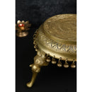 Brass Chowki - intricately carved brass platform, golden finish, perfect for placing deities or sacred objects during religious ceremonies and rituals, enhances the sanctity and beauty of the worship space, symbolizes stability and divine presence, adds a touch of elegance to your home puja setup, a valuable and ornamental addition to your collection of brass religious artifacts and decor.