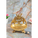 Brass Shank Trishul Chakra Diya - intricately designed brass oil lamp in the shape of a conch shell with trishul (trident) and chakra motifs, golden finish, decorative home accent, symbolizes divine energy and protection, traditional Indian Diya, emits a sacred and luminous glow, perfect for religious rituals and spiritual practices, enhances spiritual ambiance and decor with a touch of auspiciousness.