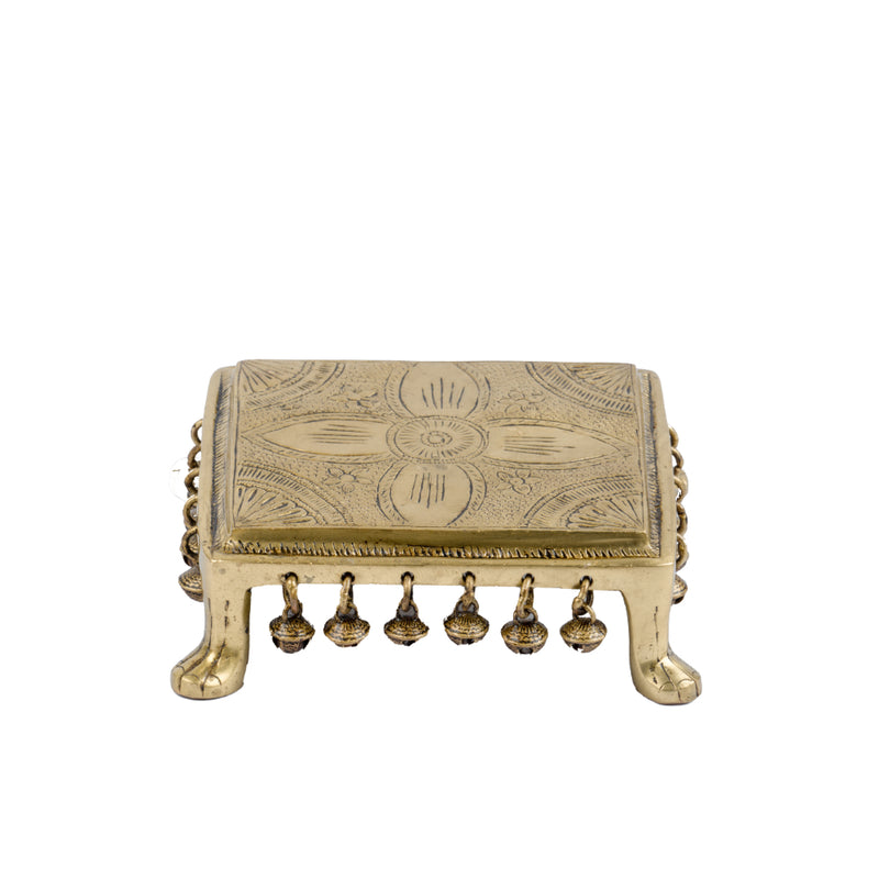 Brass Chowki - intricately carved brass platform, golden finish, perfect for placing deities or sacred objects during religious ceremonies and rituals, enhances the sanctity and beauty of the worship space, symbolizes stability and divine presence, adds a touch of elegance to your home puja setup, a valuable and ornamental addition to your collection of brass religious artifacts and decor.