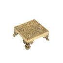 Brass Chowki - intricately carved brass platform, golden finish, perfect for placing deities or sacred objects during religious ceremonies and rituals, enhances the sanctity and beauty of the worship space, symbolizes stability and divine presence, adds a touch of elegance to your home puja setup, a valuable and ornamental addition to your collection of brass religious artifacts and decor.