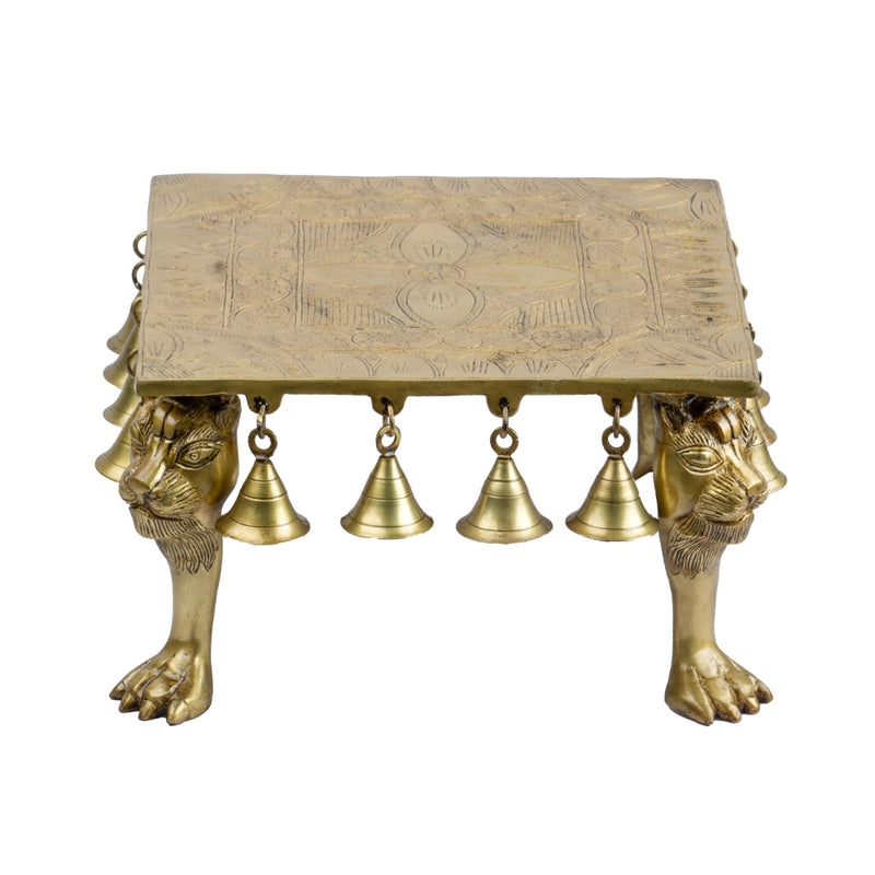 Brass Chowki - intricately carved brass platform, golden finish, perfect for placing deities or sacred objects during religious ceremonies and rituals, enhances the sanctity and beauty of the worship space, symbolizes stability and divine presence, adds a touch of elegance to your home puja setup, a valuable and ornamental addition to your collection of brass religious artifacts and decor.