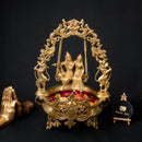 Brass Radha Krishna Ji Urli - intricately designed brass decorative bowl featuring idols of Radha and Krishna, golden finish, traditional Indian Urli, auspicious home accent, ideal for floating flower petals or candles, symbolizes divine love and devotion, adds a touch of spirituality and cultural beauty to any space, perfect for creating a serene ambiance and enhancing interior decor, a timeless piece of art for both indoor and outdoor settings.