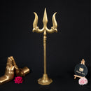 Brass Trishul - meticulously designed brass Trishul (trident), golden finish, symbolic weapon of Lord Shiva, perfect for worship and spiritual practices, ideal for creating a divine ambiance in your home or temple, represents power, protection, and destruction of negativity, enhances the spiritual energy and fosters a sense of devotion, a sacred and captivating addition to your collection of brass artifacts.