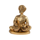 Brass Musician - intricately crafted brass statue of a musician playing a traditional instrument, golden finish, captures the beauty and rhythm of music, adds an artistic and cultural touch to your home decor, symbolizes the power of expression and creativity, perfect for music lovers and collectors, a unique and captivating addition to your collection of brass sculptures and figurines, ideal for music rooms, studios, or as a gift for musicians and enthusiasts