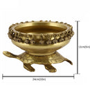 Brass Turtle Urli - intricately crafted brass decorative bowl with turtle motifs, golden finish, traditional Indian Urli, versatile home accent, ideal for floating flower petals or candles, symbolizes longevity and harmony, adds a touch of serenity and natural beauty to any space, perfect for creating a tranquil ambiance and enhancing interior decor, a timeless piece of art for both indoor and outdoor settings.
