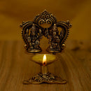Brass Ganesha Lakshmi Diya - exquisitely crafted brass oil lamp featuring Lord Ganesha and Goddess Lakshmi, golden finish, decorative home accent, symbolizes prosperity and divine blessings, traditional Indian Diya, emits a radiant and auspicious glow, perfect for religious ceremonies and festive occasions, enhances spiritual ambiance and decor with the blessings of Ganesha and Lakshmi.