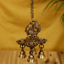 Brass peacock parrot Diya - exquisitely crafted brass oil lamp in the shape of a peacock with parrot motifs, golden finish, decorative home accent, fusion of elegance and vibrancy, traditional Indian Diya, emits a captivating and auspicious glow, perfect for festive occasions and religious ceremonies, enhances spiritual ambiance and decor with a touch of artistic brilliance.