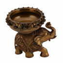 Brass Elephant Urli - meticulously designed brass decorative bowl featuring elephant motifs, golden finish, traditional Indian Urli, versatile home accent, ideal for floating flower petals or candles, symbolizes strength and wisdom, adds a touch of cultural charm and serenity to any space, perfect for creating an inviting ambiance and enhancing interior decor, a timeless piece of art for both indoor and outdoor settings.