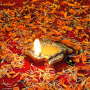 Brass small Akhand Swastic Diya - intricately designed brass oil lamp, compact size, traditional Indian Diya, golden finish, decorative home accent, emits a warm and serene glow, ideal for religious ceremonies and meditation, enhances spiritual ambiance and decor.