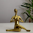 Brass Yoga Lady - beautifully sculpted brass statue of a female yogi in a yoga pose, golden finish, represents strength, balance, and mindfulness, perfect for yoga enthusiasts and spiritual practitioners, adds a serene and calming element to your home decor, symbolizes the harmony between mind, body, and spirit, a unique and inspiring addition to your collection of brass sculptures and figurines, ideal for yoga studios and meditation spaces.