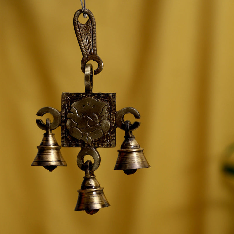 Brass Lakshmi Ganesh Saraswati Bells - exquisitely crafted brass bells featuring the deities Lakshmi, Ganesh, and Saraswati, golden finish, decorative home accent, emits a harmonious and divine sound, perfect for invoking blessings and wisdom, ideal for spiritual practices, rituals, and festive occasions, symbolizes prosperity, success, and knowledge, enhances the ambiance with positive vibrations and divine energy, a sacred and auspicious addition to your collection of brass artifacts.