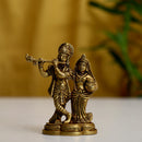 Brass God Radha Krishna Ji - intricately designed brass statue featuring Lord Krishna and Radha, golden finish, divine and eternal divine couple, perfect for home decor and spiritual spaces, ideal for invoking love, devotion, and divine union, symbolizes divine love, harmony, and transcendence, enhances the spiritual energy and fosters a sense of divine presence, a sacred and cherished addition to your collection of brass sculptures and figurines."