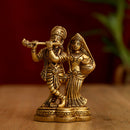 Brass God Radha Krishna Ji - intricately designed brass statue featuring Lord Krishna and Radha, golden finish, divine and eternal divine couple, perfect for home decor and spiritual spaces, ideal for invoking love, devotion, and divine union, symbolizes divine love, harmony, and transcendence, enhances the spiritual energy and fosters a sense of divine presence, a sacred and cherished addition to your collection of brass sculptures and figurines."