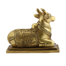 Brass God Nandi Cow - beautifully sculpted brass statue of Nandi, the sacred bull and vahana (vehicle) of Lord Shiva, golden finish, revered and divine deity, perfect for home decor and spiritual spaces, ideal for invoking blessings and divine guidance, symbolizes strength, devotion, and fertility, enhances the spiritual energy and fosters a sense of divine presence, a sacred and auspicious addition to your collection of brass sculptures and figurines.