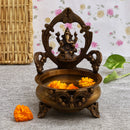 Brass Lakshmi & Ganesh Ji Urli - intricately crafted brass decorative bowl featuring idols of Goddess Lakshmi and Lord Ganesh, golden finish, traditional Indian Urli, versatile home accent, ideal for floating flower petals or candles, symbolizes prosperity and blessings, adds a touch of divinity and cultural richness to any space, perfect for creating an auspicious ambiance and enhancing interior decor, a timeless piece of art for both indoor and outdoor settings.