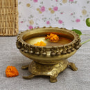 Brass Turtle Urli - intricately crafted brass decorative bowl with turtle motifs, golden finish, traditional Indian Urli, versatile home accent, ideal for floating flower petals or candles, symbolizes longevity and harmony, adds a touch of serenity and natural beauty to any space, perfect for creating a tranquil ambiance and enhancing interior decor, a timeless piece of art for both indoor and outdoor settings.