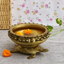 Brass Turtle Urli - intricately crafted brass decorative bowl with turtle motifs, golden finish, traditional Indian Urli, versatile home accent, ideal for floating flower petals or candles, symbolizes longevity and harmony, adds a touch of serenity and natural beauty to any space, perfect for creating a tranquil ambiance and enhancing interior decor, a timeless piece of art for both indoor and outdoor settings.
